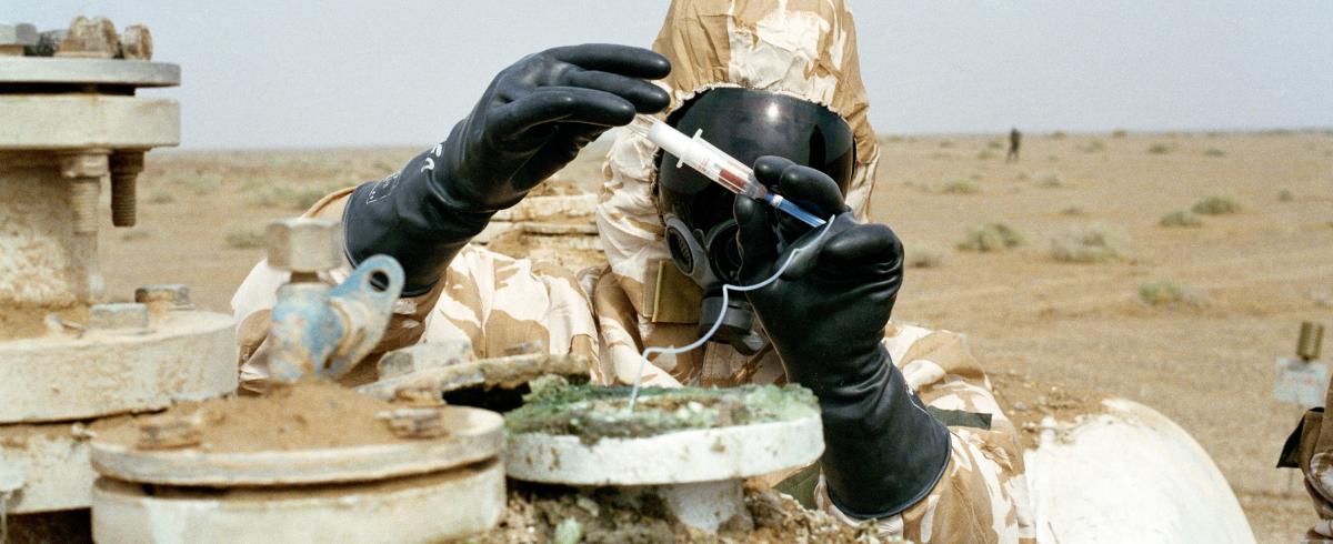 Soldier handling chemical weapon