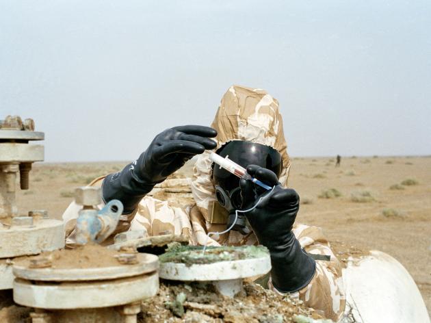 Soldier handling chemical weapon